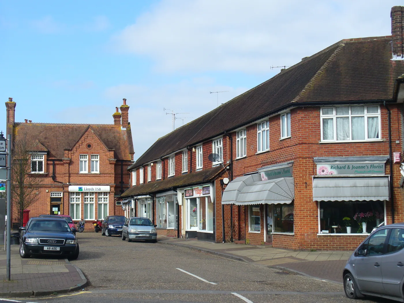 High Road, Byfleet. Three of the businesses whose August ratings were published late are on this road. The photograph shows the street, not any of those businesses.