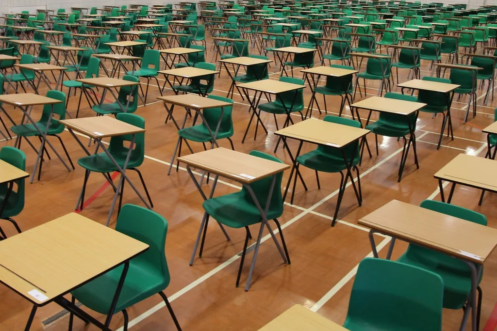 An exam hall laid out for GCSEs. This is a library photograph and does not show a Woking school.
