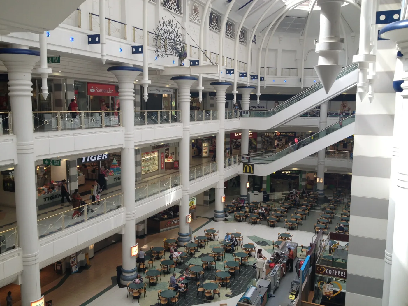 Inside the Peacocks Centre, Woking. The photograph shows the shopping centre, not any incident in the figures.